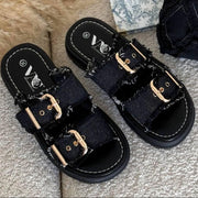 Mules en jean à boucles dorées